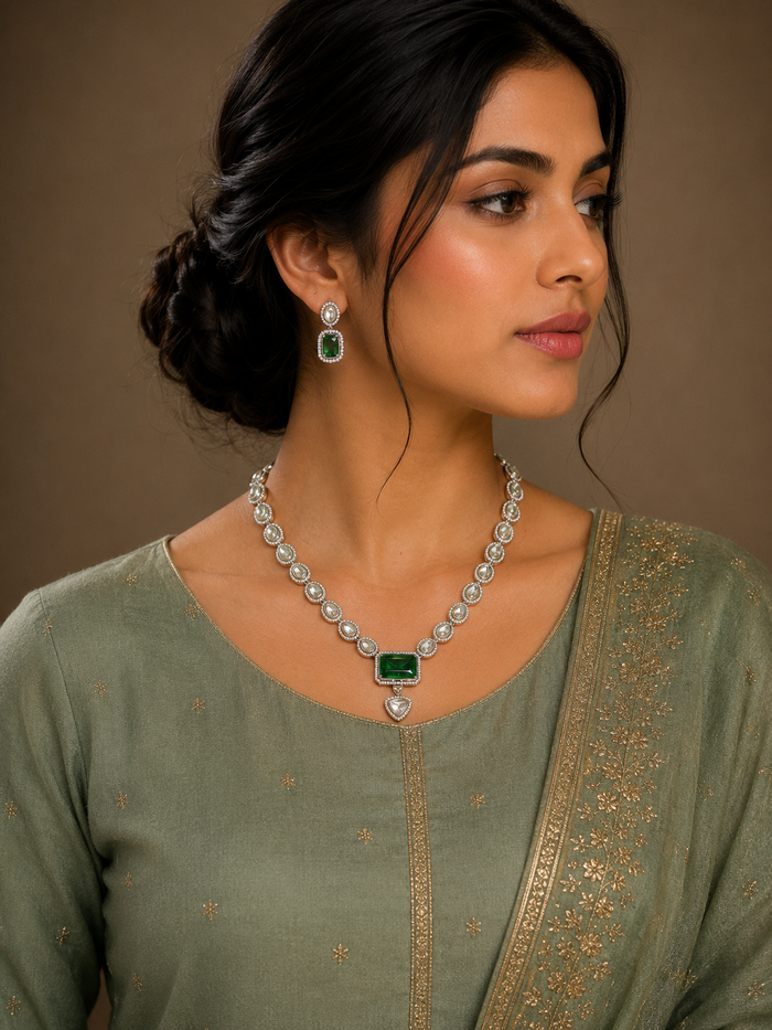 Silver-tone polki necklace with emerald-green emerald-cut pendant and matching earrings